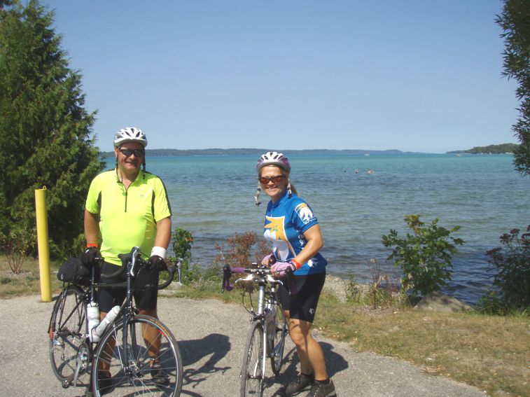 Andy and Theresa with a lake behind them